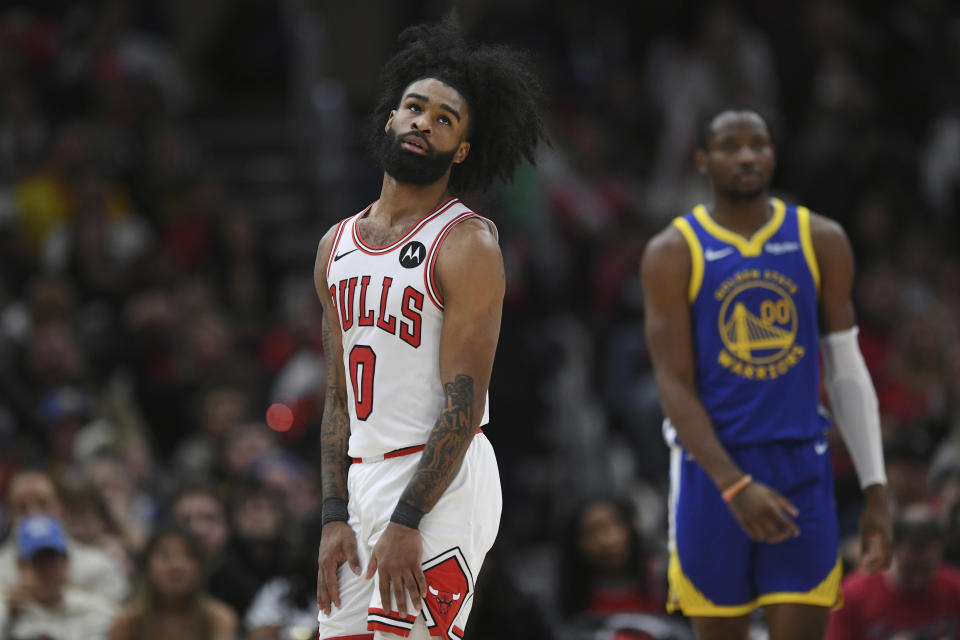 Chicago Bulls' Coby White (0) reacts during the final minutes of the team's NBA basketball game against the Golden State Warriors on Friday, Jan 12, 2024, in Chicago. (AP Photo/Paul Beaty)