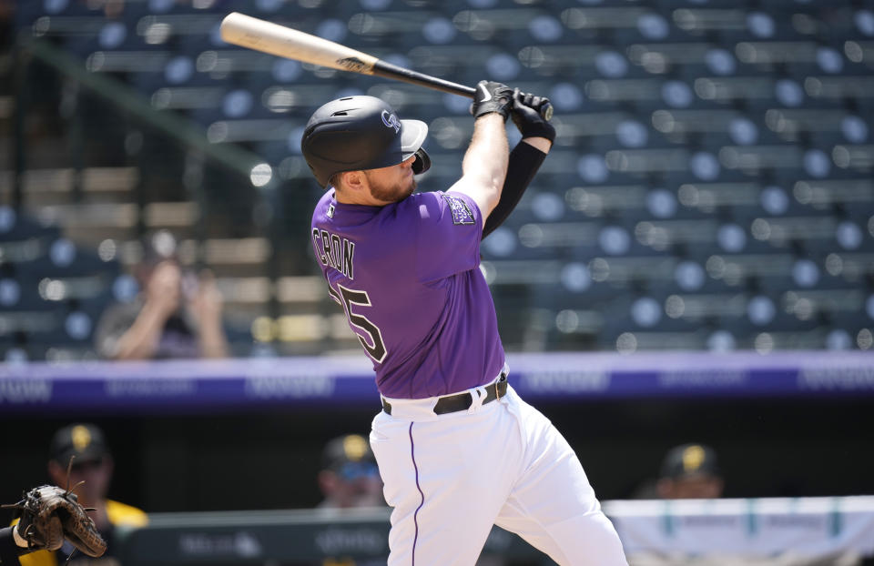 Colorado Rockies' C.J. Cron connects for a solo home run off Pittsburgh Pirates starting pitcher Chad Kuhl in the fourth inning of a baseball game Wednesday, June 30, 2021, in Denver. (AP Photo/David Zalubowski)