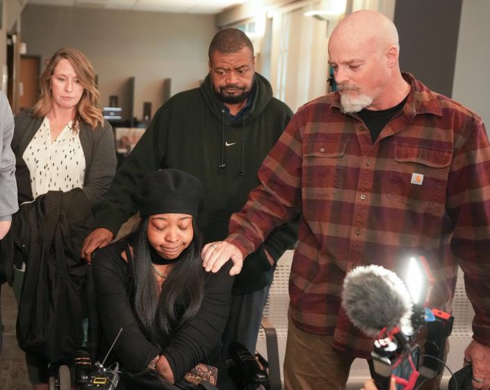 Stephen Foster, right, the father of Garrett Foster, comforts Whitney Mitchell, the fiancee of Garrett Foster, after Daniel Perry was convicted of the  murder of Garrett Foster at the Blackwell-Thurman Criminal Justice Center on Friday April 7, 2023.