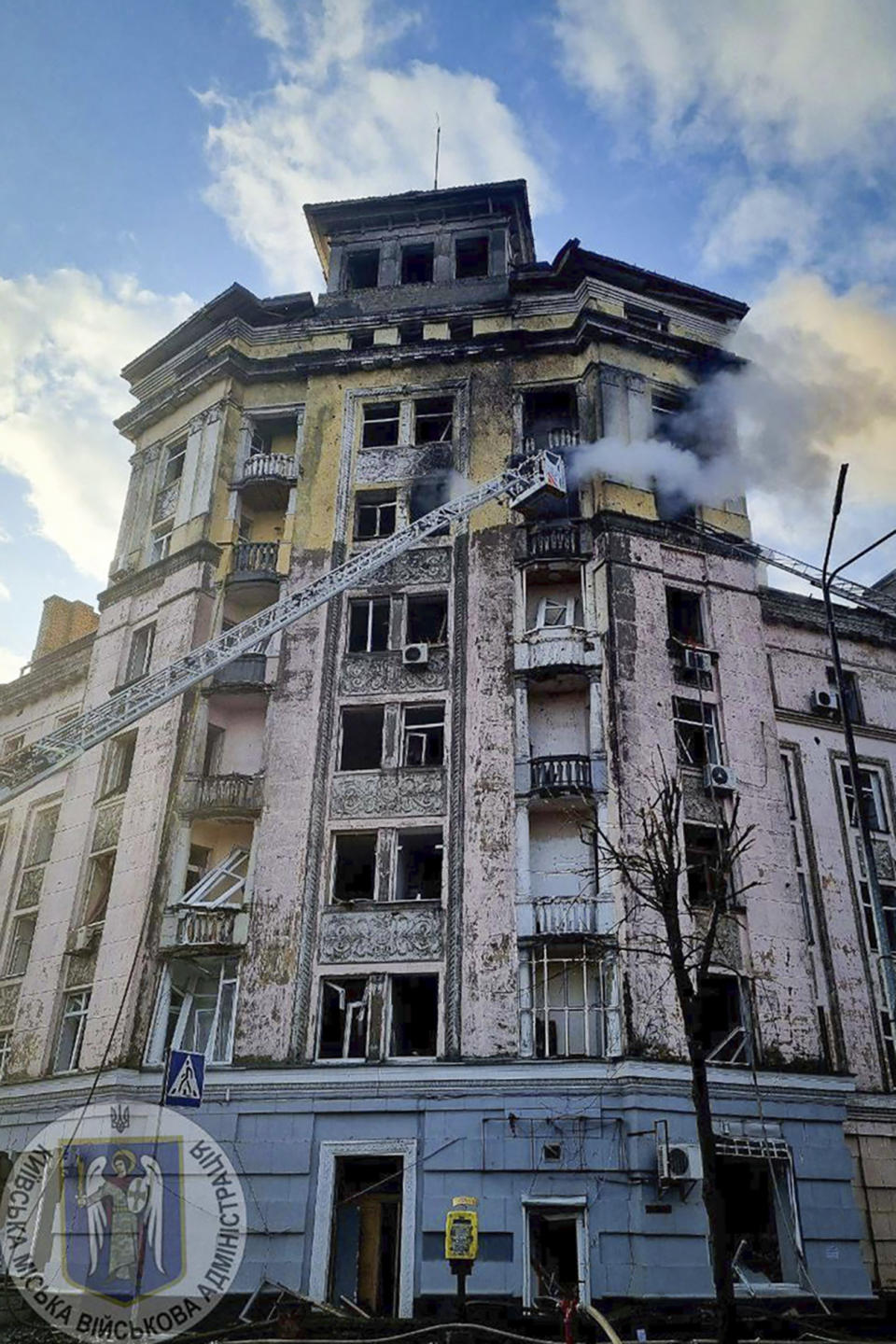 In this photo provided by Serhii Popko, the head of the city's military administration, firefighters work at the site after Russian attacks in Kyiv, Ukraine, Thursday, March 21, 2024. Around 30 cruise and ballistic missiles were shot down over Kyiv on Thursday morning, according Serhii Popko. The missiles were entering Kyiv simultaneously from various directions in a first missile attack on the capital in 44 days. (Serhii Popko, the head of the city's military administration via AP)