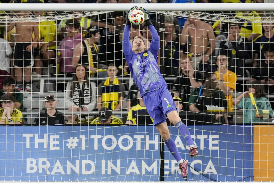 Nashville SC goalkeeper Joe Willis (1) catches the ball as he defends the goal against CF Montréal during the second half of an MLS soccer match Saturday, May 4, 2024, in Nashville, Tenn. Nashville SC won 4-1. (AP Photo/George Walker IV)
