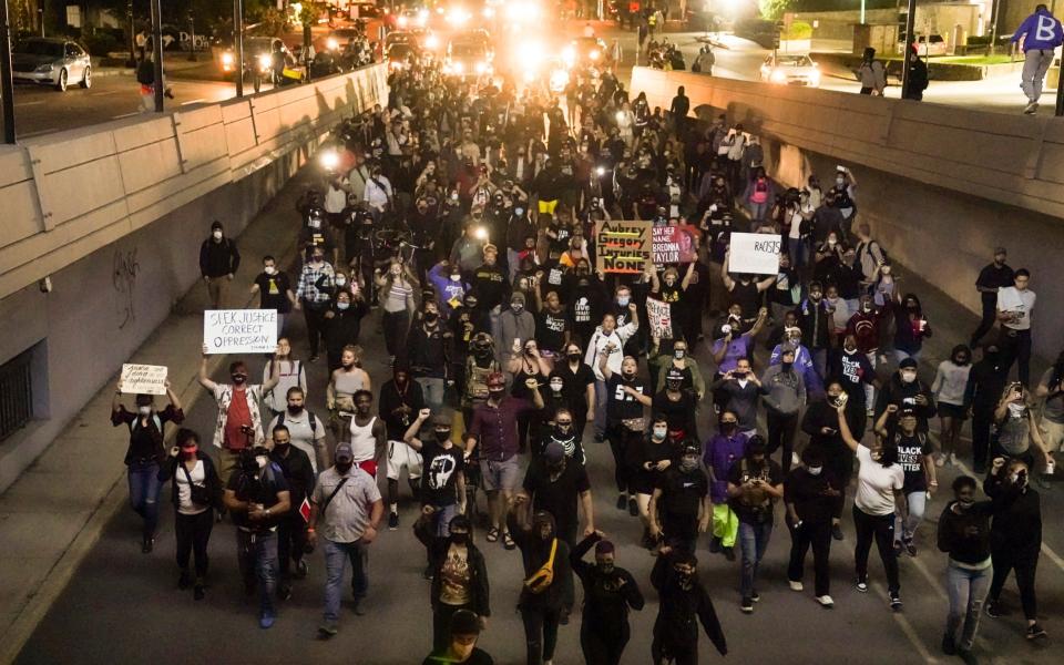 Authorities pleaded for calm while activists vowed to protest in Kentucky's largest city - AP