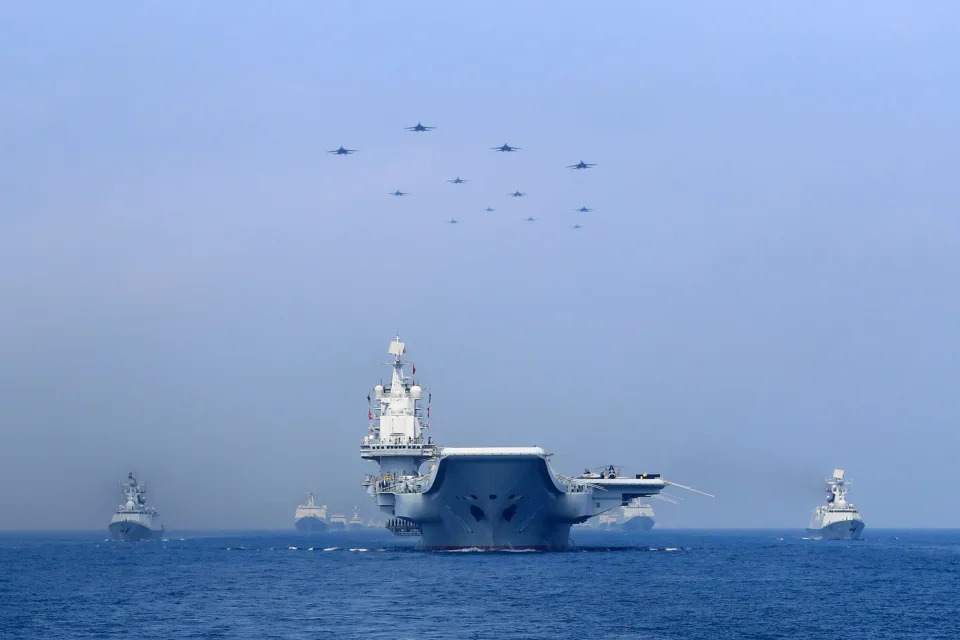 Warships and fighter jets of Chinese People's Liberation Army (PLA) Navy take part in a military display in the South China Sea in April 2018.