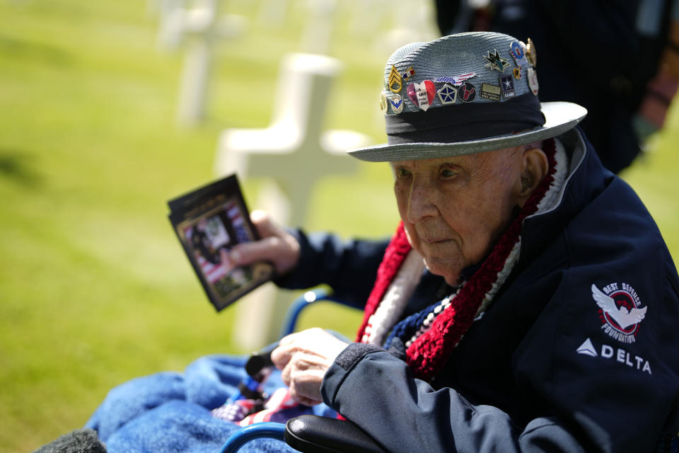 World War II and D-Day veteran Jake Larson visits graves at the Normandy American Cemetery in Colleville-sur-Mer, Tuesday, June 4, 2024. World War II veterans from across the United States as well as Britain and Canada are in Normandy this week to mark 80 years since the D-Day landings that helped lead to Hitler's defeat. (AP Photo/Virginia Mayo)