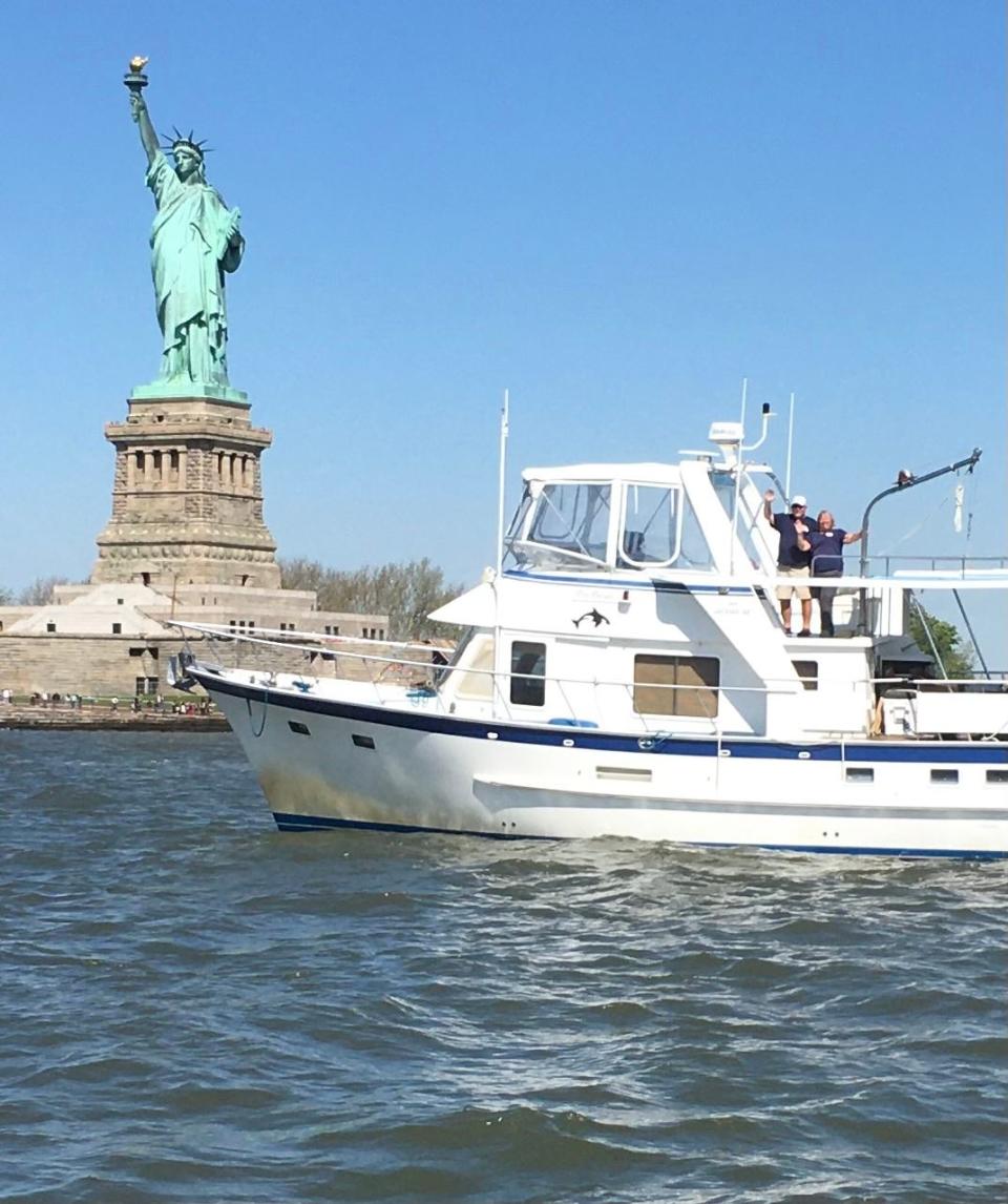 Rick and Sue Rosenwald pose in front of the Statue of Liberty. Going past the Statue of Liberty was one of Sue's favorite parts of the Great Loop.