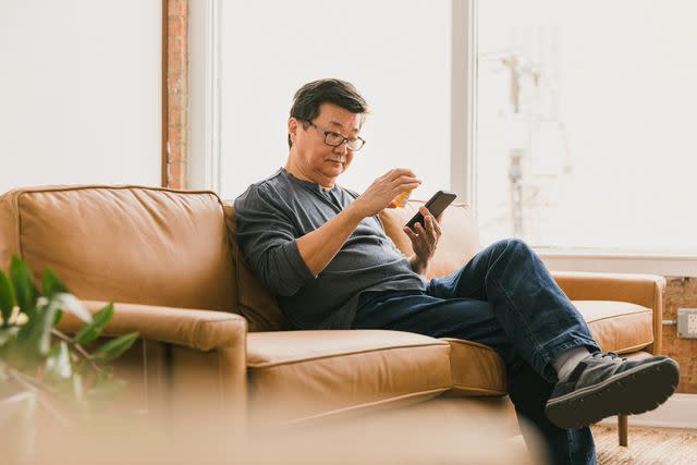 <p>SDI Productions / Getty Images</p> Older male uses pharmacy mobile app to refill prescription