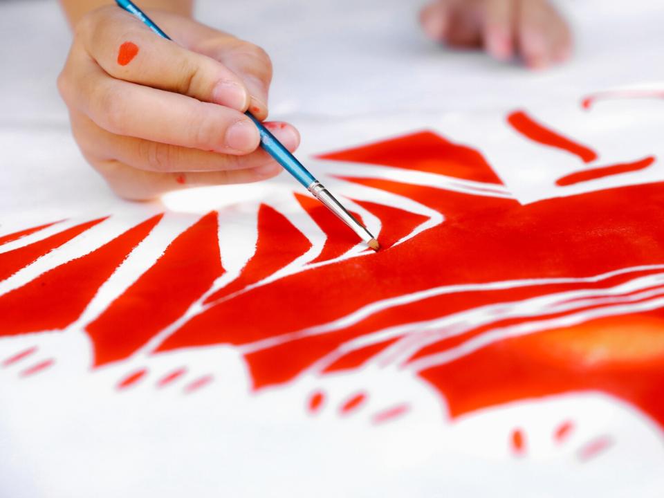 Chan paints a kite at Clockshop in Los Angeles.