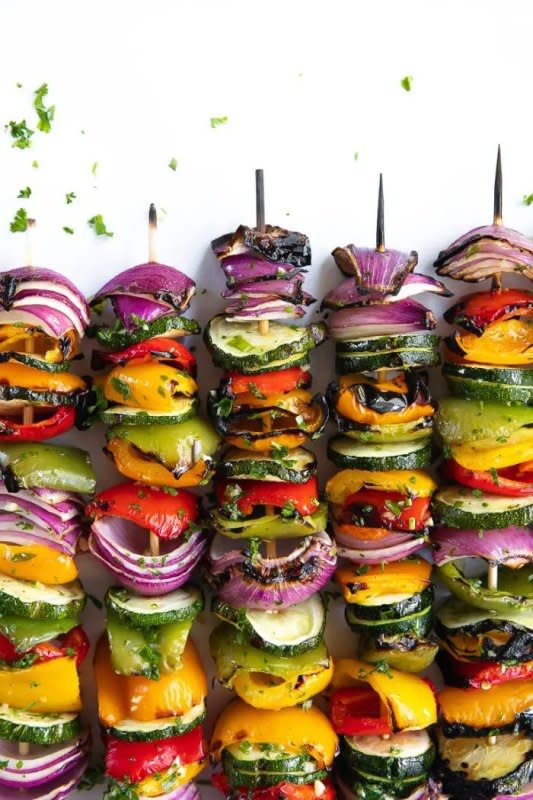 <p>The Forked Spoon</p><p>Veggie Skewers made with zucchini, red onion, and bell peppers are grilled to perfection and drizzled with tangy balsamic vinegar and brushed with a fresh garlic herb sauce.</p><p><strong>Get the recipe: <a href="https://theforkedspoon.com/veggie-skewers/" rel="nofollow noopener" target="_blank" data-ylk="slk:Easy Grilled Veggie Skewers;elm:context_link;itc:0;sec:content-canvas" class="link rapid-noclick-resp">Easy Grilled Veggie Skewers</a></strong></p>