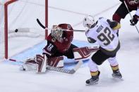 Oct 7, 2017; Glendale, AZ, USA; Arizona Coyotes goalie Antti Raanta (32) makes a save against Vegas Golden Knights left wing Tomas Nosek (92) during the first period at Gila River Arena. Mandatory Credit: Matt Kartozian-USA TODAY Sports