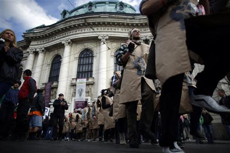 Protesting students wearing fake military uniforms march during a demonstration in front of Sofia University November 20, 2013. REUTERS/Stoyan Nenov