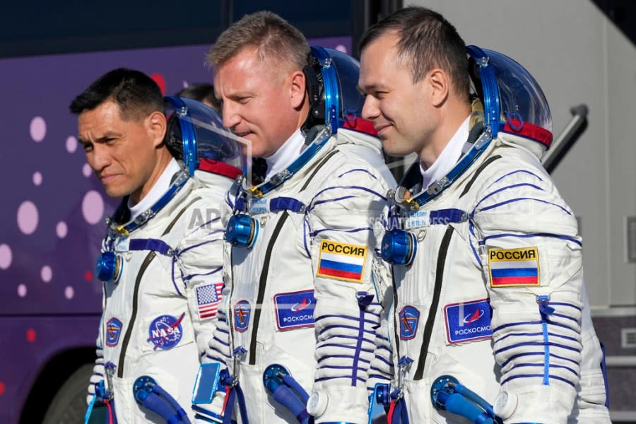 FILE – From left, NASA astronaut Frank Rubio, Roscosmos cosmonauts Sergey Prokopyev and Dmitri Petelin, crew members of the mission to the International Space Station (ISS), walk to the rocket prior the launch of Soyuz-2.1 rocket, at the Russian leased Baikonur cosmodrome, Kazakhstan, Wednesday, Sept. 21, 2022. The three are expected to return to Earth on Wednesday, Sept; 27, 2023, after being stuck in space for just over a year after their original capsule was hit by space junk. The 180-day mission turned into a 371-day stay. (AP Photo/Dmitri Lovetsky, Pool, File)