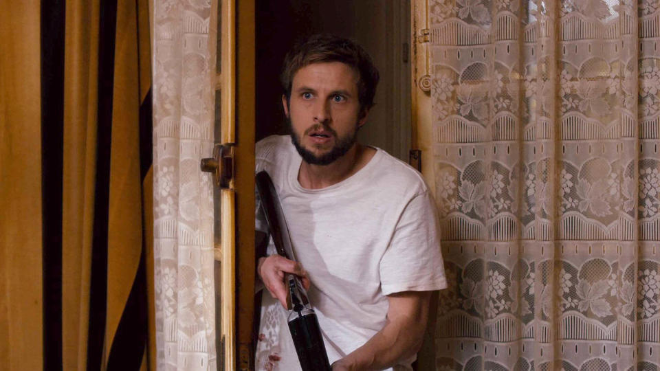 Sam, the sole human survivor in Paris, hiding with a gun