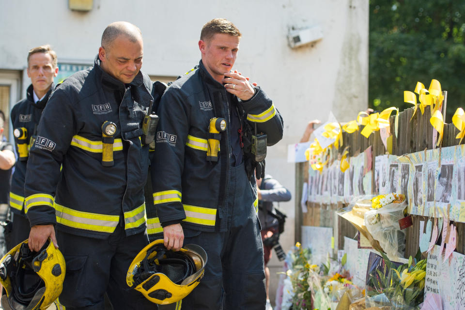 Firefighters in the aftermath of the Grenfell tragedy (Picture: PA)