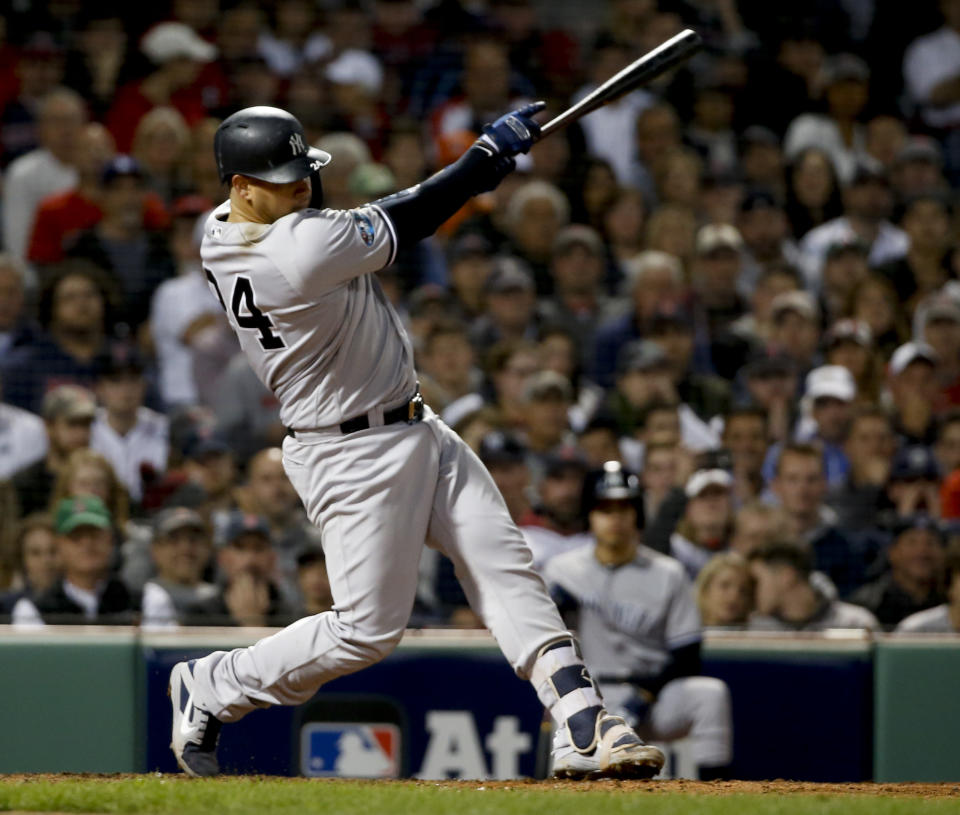 New York Yankees' Gary Sanchez watches his three-run home run against the Boston Red Sox during the seventh inning of Game 2 of a baseball American League Division Series, Saturday, Oct. 6, 2018, in Boston. (AP Photo/Elise Amendola)