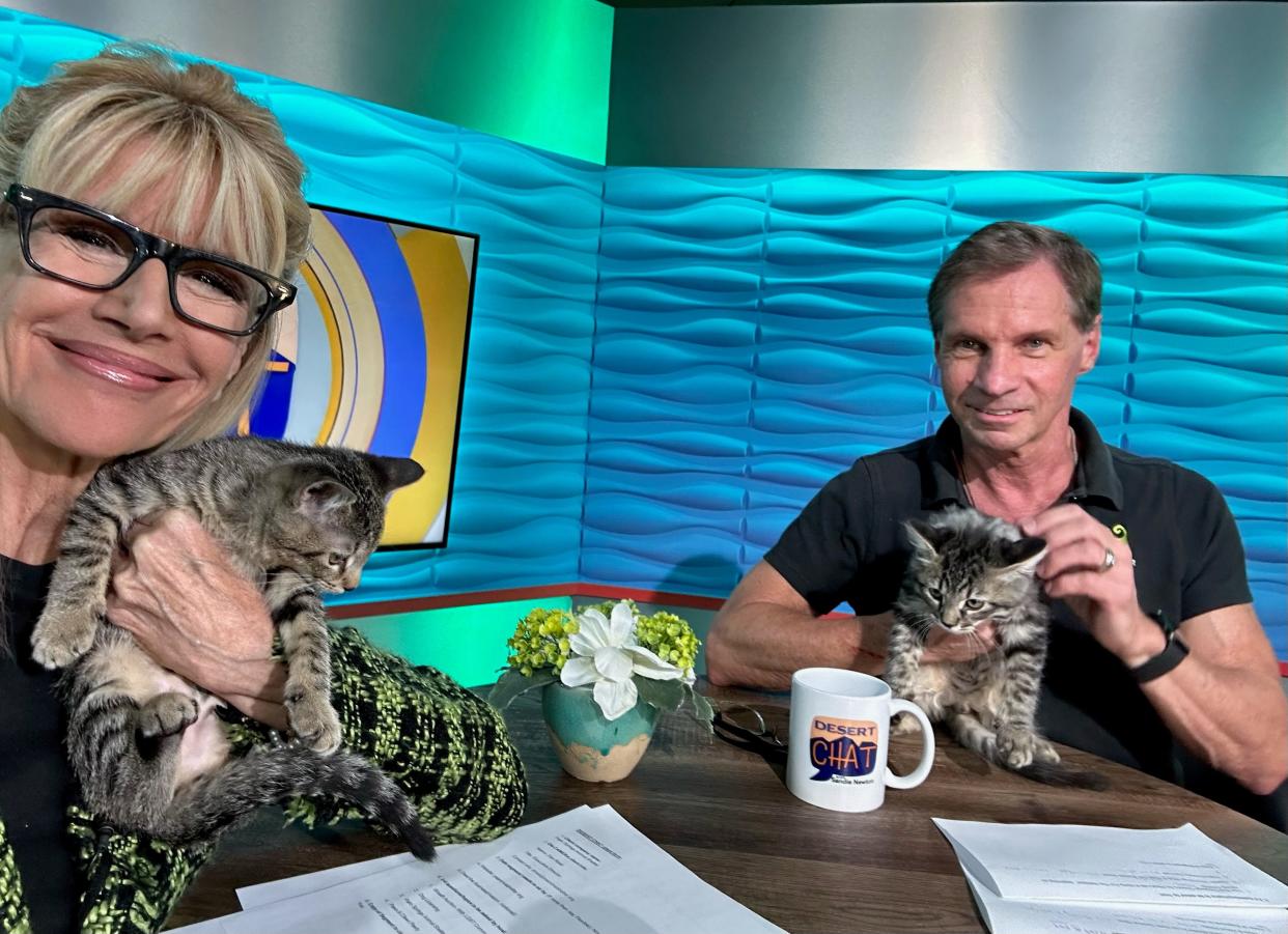 Sandie Newton and Dan Rossi show love to their furry friends.