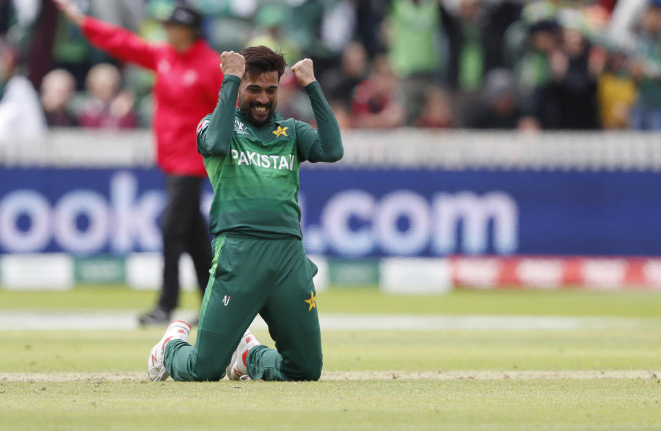 Pakistan's Mohammad Amir celebrates after taking the wicket of Australia's Mitchell Starc during the Cricket World Cup match between Australia and Pakistan at the County Ground in Taunton, south west England, Wednesday, June 12, 2019. (AP Photo/Alastair Grant)