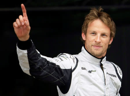 FILE PHOTO - Brawn GP Formula One driver Jenson Button of Britain waves after qualifying in pole position for the Spanish F1 Grand Prix at the Catalunya racetrack in Montmelo, near Barcelona, May 9, 2009. REUTERS/Dani Cardona/File Photo