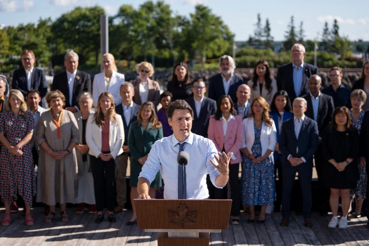 Prime Minister Justin Trudeau speaks to reporters as cabinet members look on during the Liberal cabinet retreat in Charlottetown on Wednesday. (Darren Calabrese/The Canadian Press - image credit)