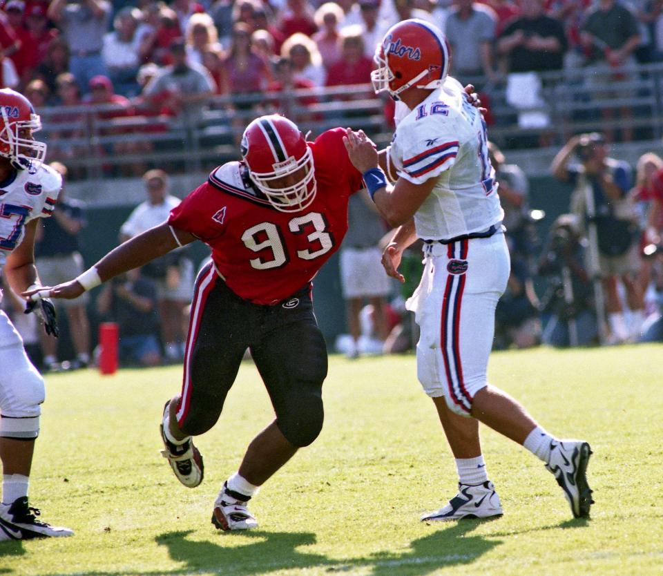 Georgia defensive tackle Richard Seymour (93) rushes Florida QB Doug Johnson, Oct. 31, 1998, in Jacksonville.