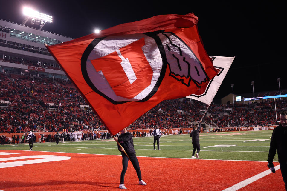 Nov 12, 2022; Salt Lake City, Utah, USA; The Utah Utes cheer team waves flags after a touchdown against the Stanford Cardinal in the fourth quarter at Rice-Eccles Stadium. Mandatory Credit: Rob Gray-USA TODAY Sports