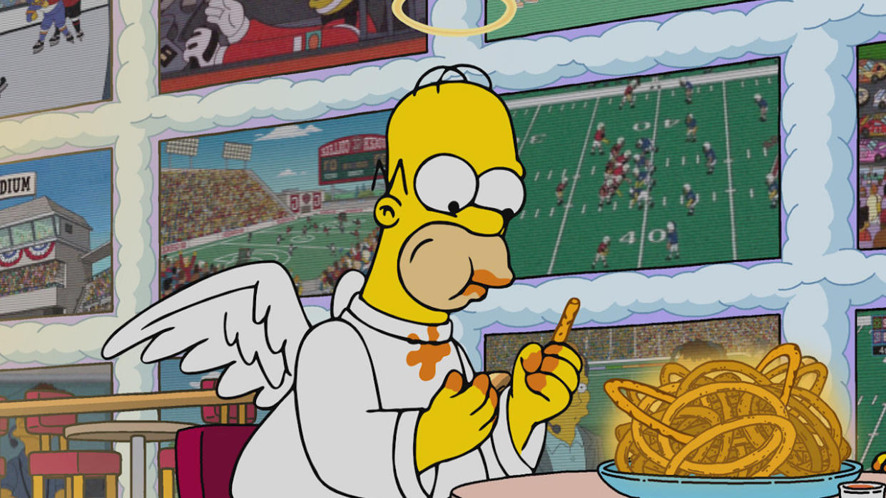  Angel Homer eating in heaven on The Simpsons. 