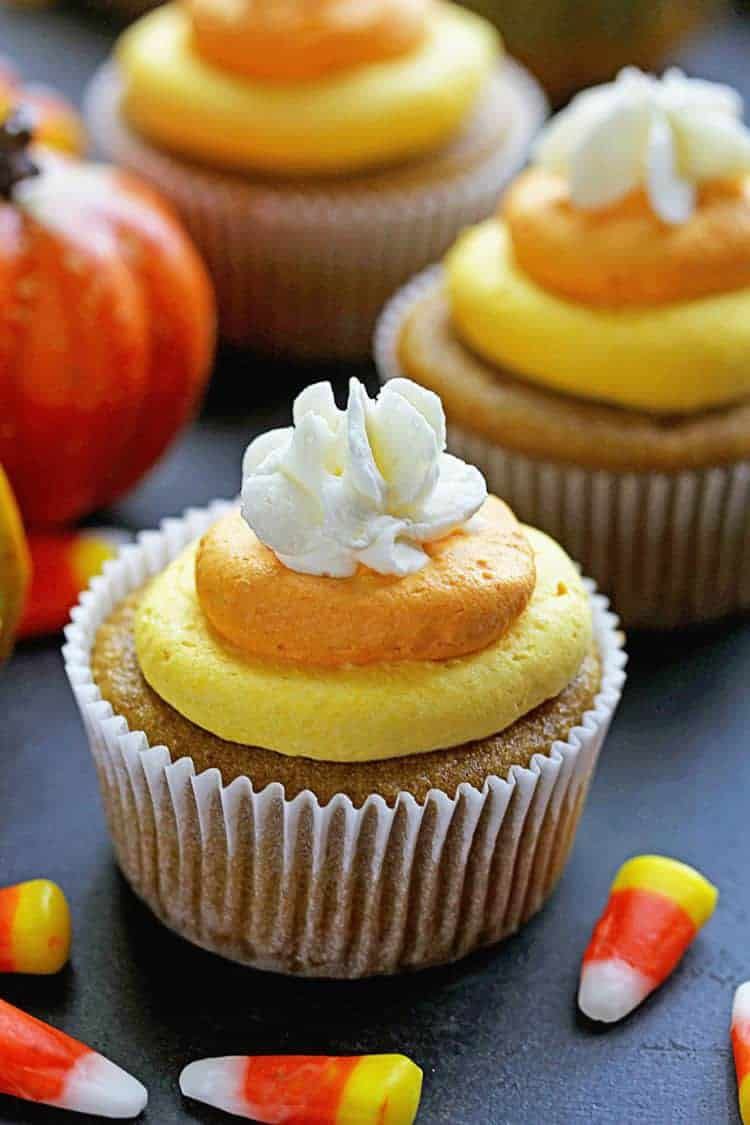 <p>Mimc Halloween's classic candy by tinting buttercream orange, yellow and white.</p><p><em><a href="https://grandbaby-cakes.com/pumpkin-cupcakes-candy-corn-buttercream/" rel="nofollow noopener" target="_blank" data-ylk="slk:Get the recipe from Grandbaby Cakes »;elm:context_link;itc:0;sec:content-canvas" class="link ">Get the recipe from Grandbaby Cakes »</a></em></p>