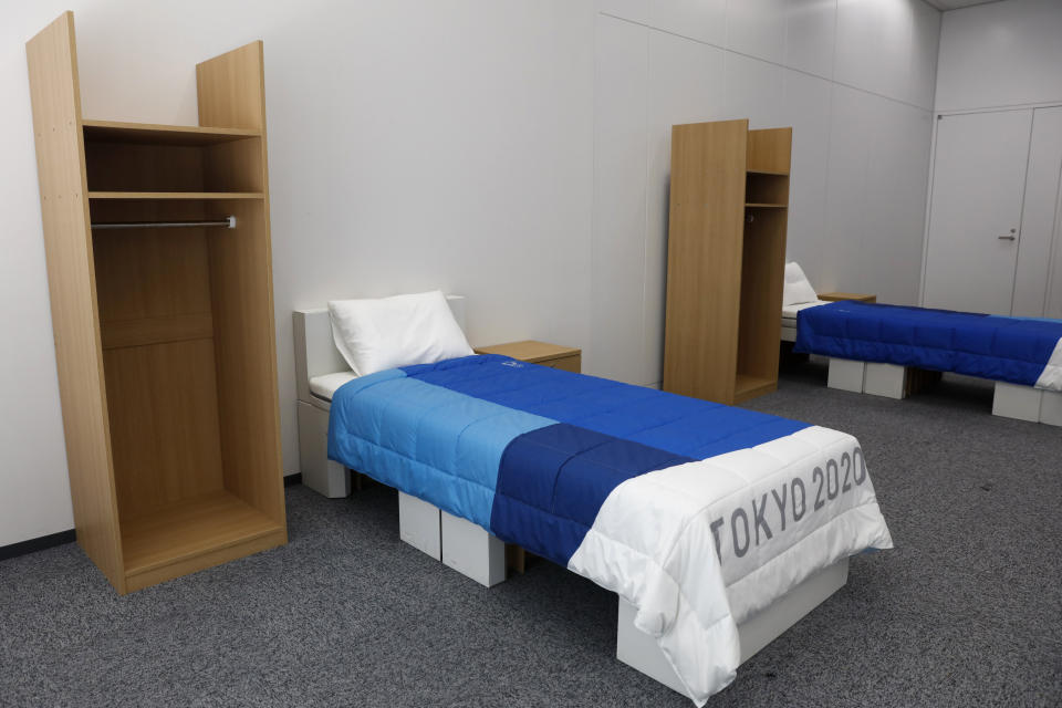 Two sets of bedroom furniture, including cardboard beds, for the Tokyo 2020 Olympic and Paralympic Villages are shown in a display room Thursday, Jan. 9, 2020, in Tokyo. Tokyo Olympic athletes beware - particularly larger ones. The single bed frames in the Athletes Village at this year's Olympics will be made of cardboard. The single bed frames will be recycled into paper products after the games. The mattress components - the mattress are not made of cardboard - will be recycled into plastic products.. (AP Photo/Jae C. Hong)