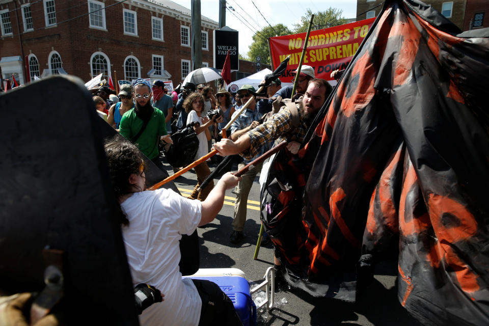 <p>Members of white nationalists clash a group of counter-protesters in Charlottesville, Va., on Aug. 12, 2017. (Photo: Joshua Roberts/Reuters) </p>