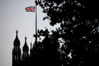 The Union Flag flies over the Victoria Tower, Houses of Parliament, in London, Friday, Oct. 18, 2019. Britain's Parliament is set to vote Saturday on Prime Minister Boris Johnson's new deal with the European Union, a decisive moment in the prolonged bid to end the Brexit stalemate. Various scenarios may be put in motion by the vote. (AP Photo/Alberto Pezzali)