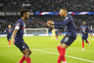 France's Kylian Mbappe, right, celebrates after scoring his side's second goal during the World Cup 2022 group D qualifying soccer match between France and Kazakhstan at the Parc des Princes stadium in Paris, France, Saturday, Nov. 13, 2021. (AP Photo/Michel Euler)