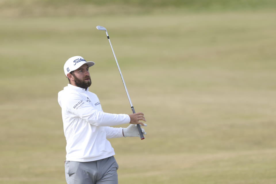 Cameron Young of the US plays a shot on the 4th hole during the first round of the British Open golf championship on the Old Course at St. Andrews, Scotland, Thursday, July 14 2022. The Open Championship returns to the home of golf on July 14-17, 2022, to celebrate the 150th edition of the sport's oldest championship, which dates to 1860 and was first played at St. Andrews in 1873. (AP Photo/Peter Morrison)