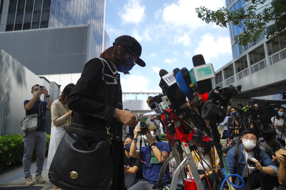 Mrs. Poon, the mother of a young woman killed in Taiwan, speaks to the media outside the government headquarters in Hong Kong, Wednesday, Oct. 20, 2021. Mrs. Poon, whose daughter Poon Hiu-wing was killed while visiting Taiwan in 2018, has lambasted Hong Kong authorities for letting suspect Chan Tong-kai walk free, instead of sending him to Taiwan to turn himself in. (AP Photo/Kin Cheung)