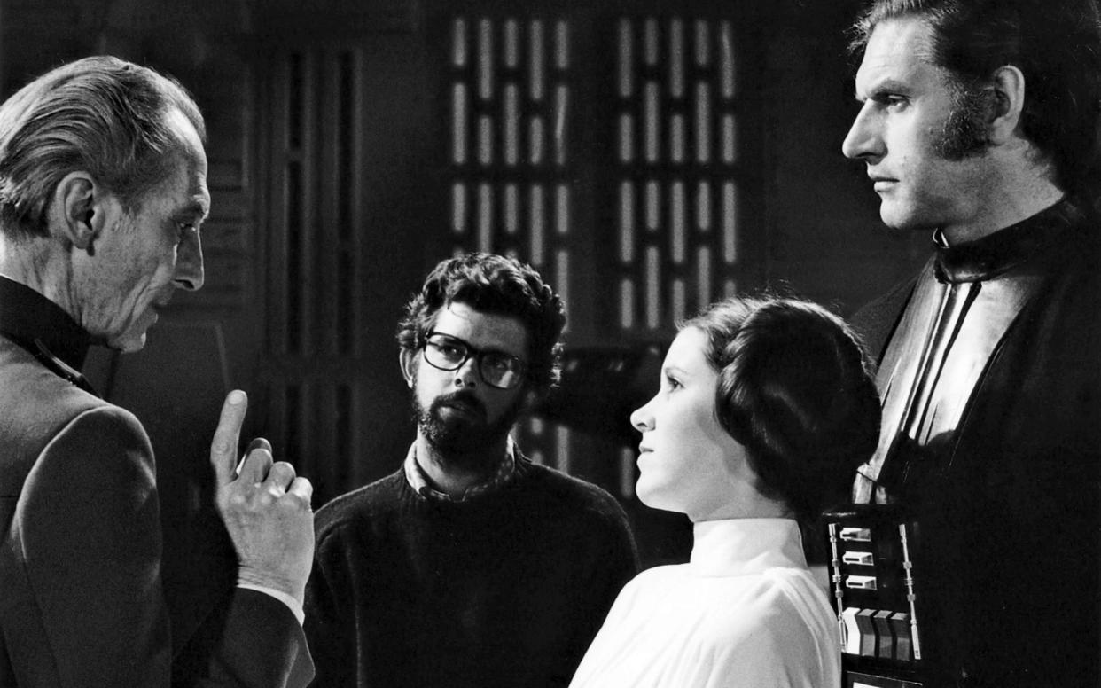 Dave Prowse on the set of Star Wars: Episode IV - A New Hope with Peter Cushing, George Lucas and Carrie Fisher - Corbis Historical