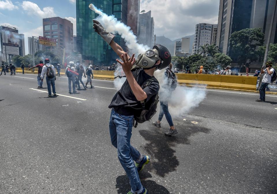 Opposition activists clash with riot police on April 26.