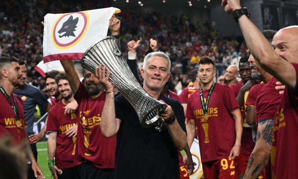 José Mourinho celebrates with the trophy after Roma won the Europa Conference League final against Feyenoord.