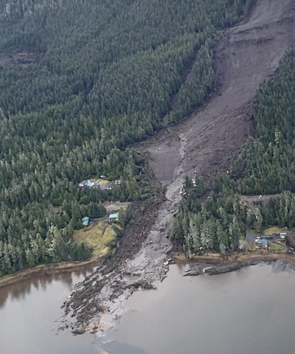 This image from video provided by Sunrise Aviation shows the landslide that occurred the previous evening near Wrangell, Alaska, on Nov. 21, 2023. Authorities said at least one person died and others were believed missing after the large landslide roared down a mountaintop into the path of three homes. (Sunrise Aviation via AP)