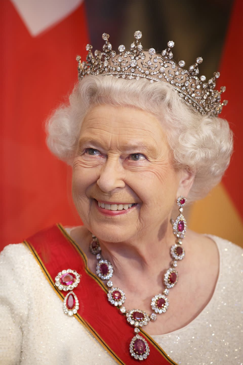 <p> On September 9, 2015, Queen Elizabeth II became the <a href="https://www.countryliving.com/uk/news/a39102607/longest-reigning-monarchs/" rel="nofollow noopener" target="_blank" data-ylk="slk:longest-reigning British monarch" class="link ">longest-reigning British monarch</a> and female head of state. Here, the Queen attends a banquet during a visit to Berlin. She's also the most-traveled head of state, with 261 overseas visits and 96 state visits to 116 countries (as of her Diamond Jubilee in 2012). </p>