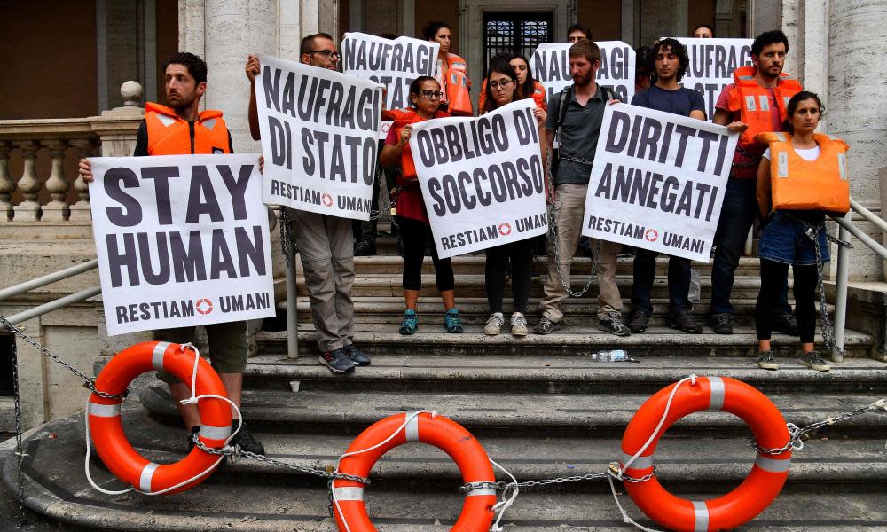 Activists protest against the Italian government’s policy towards migrants in Rome on Wednesday.