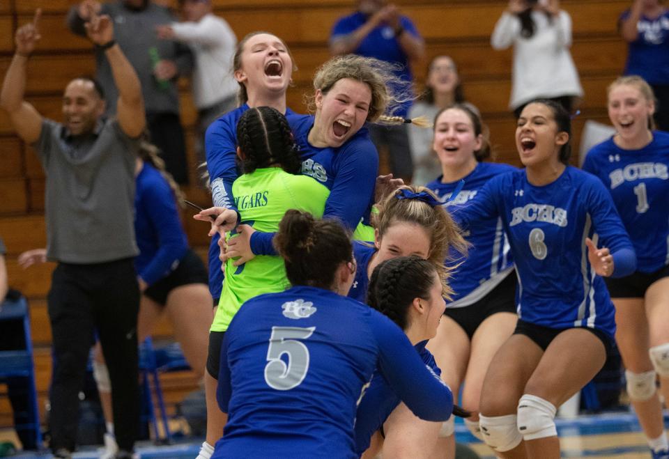 Barron Collier celebrates their 3-0 win over Wesley Chapel in the 5A state volleyball semifinals on Saturday, Nov. 5, 2022, at Barron Collier High School in Naples.