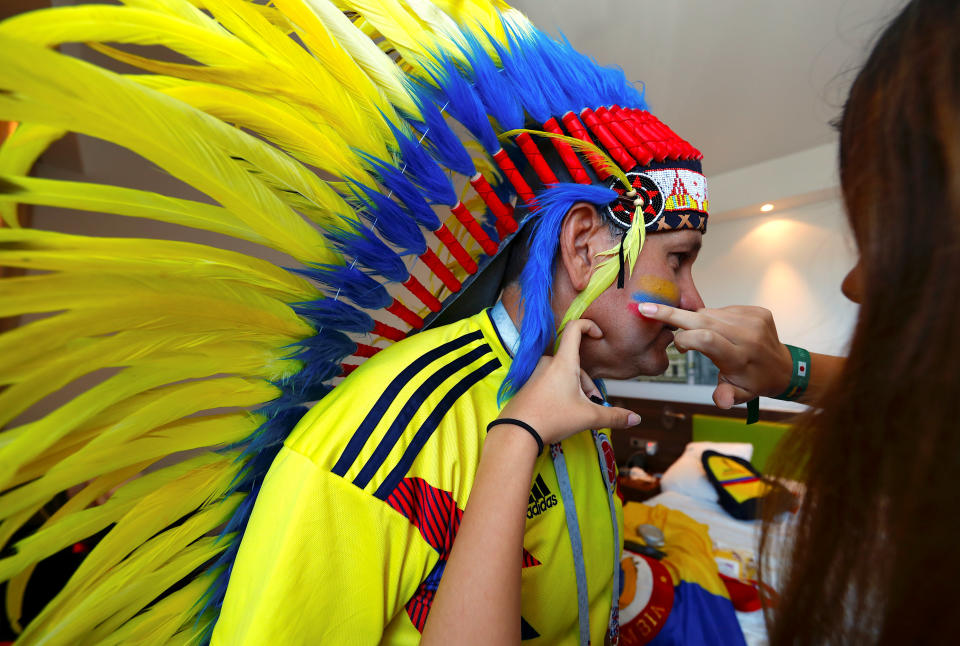 <p>Colombia fan Edgar Marquez has his face painted ahead of the clash with Senegal </p>