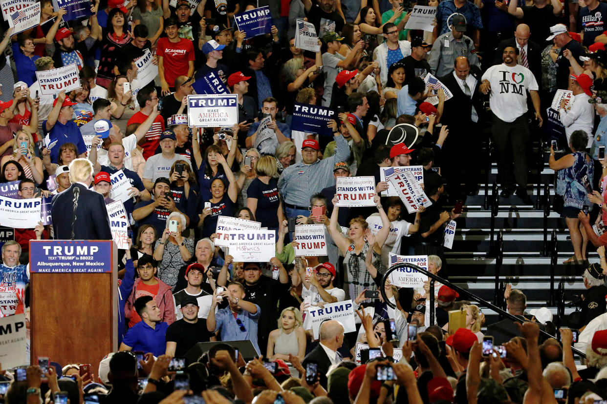 Republican presidential candidate Donald Trump watches as a protester is escorted from his rally May 24 in Albuquerque, New Mexico (Photo: Jonathan Ernst/Reuters)