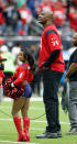 <p>Honorary cheerleader Simone Biles and Homefield Advantage Captain Hakeem Olajuwon during a game between the San Francisco 49ers v Houston Texans at NRG Stadium on December 10, 2017 in Houston, Texas. (Photo by Bob Levey/Getty Images) </p>