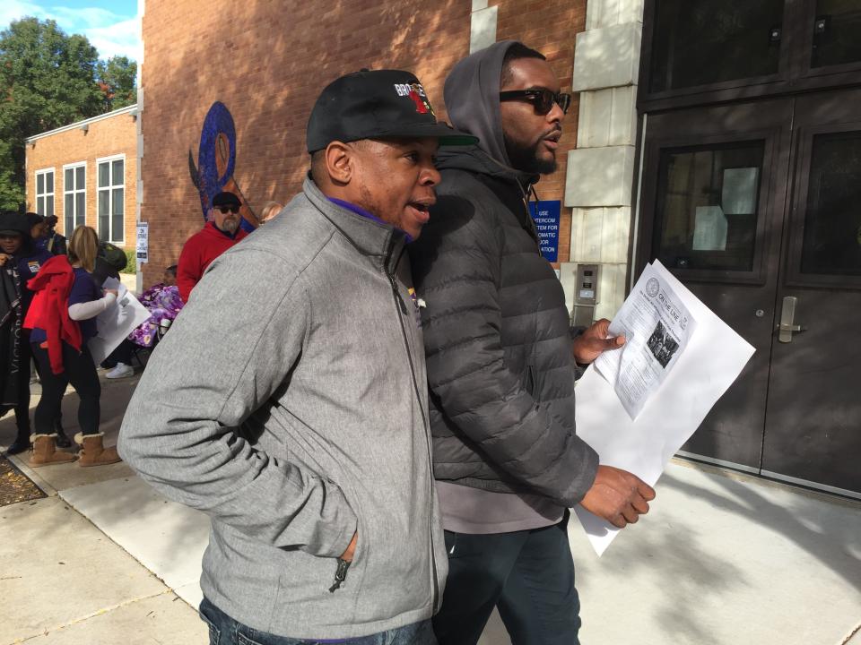 Jonathan Williams, left, joins the picket line outside Wilma Rudolph Learning Center in Chicago on Oct. 17.