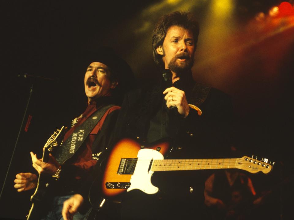 Kix Brooks (L) and Ronnie Dunn of Brooks & Dunn perform at Shoreline Amphitheatre on September 21, 1996 in Mountain View, California.