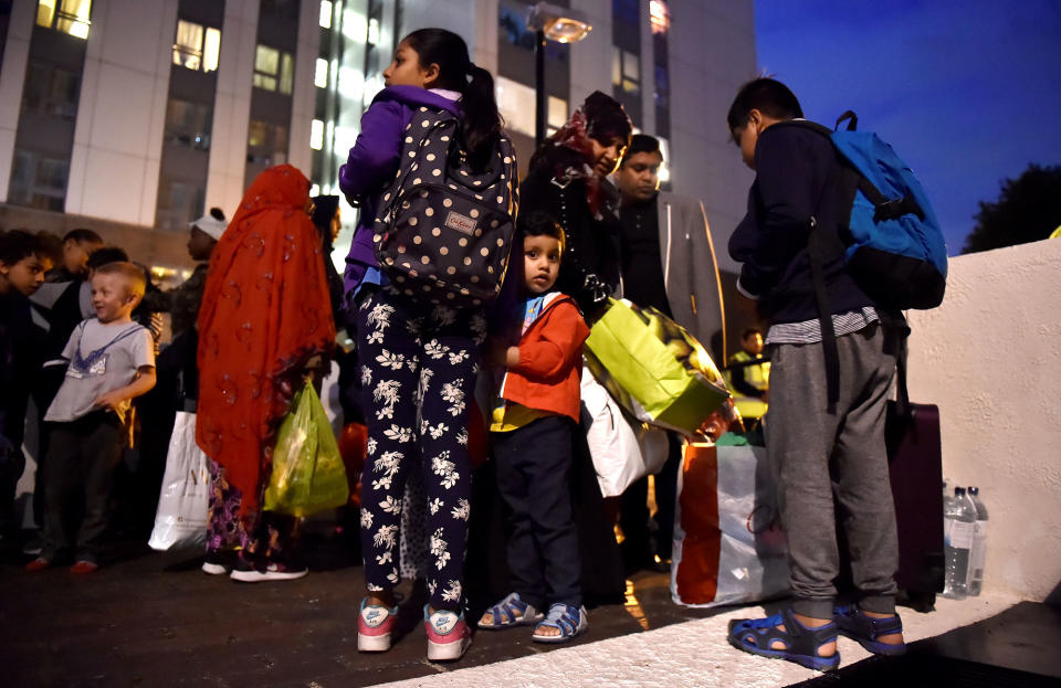 <p>Residents are evacuated from the Taplow Tower residential block as a precautionary measure following concerns over the type of cladding used on the outside of the building on the Chalcots Estate in north London, Britain, June 23, 2017. (Photo: Hannah McKay/Reuters) </p>