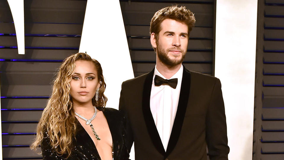 Miley Cyrus and Liam Hemsworth on red carpet