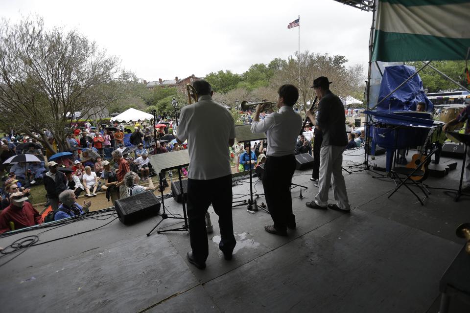 Bamm Gibson and the New Orleans Hot Jazz perform on the first day of the annual French Quarter Festival in New Orleans, Thursday, April 11, 2013. French Quarter Festival, which turns 30 this year, runs through Sunday and showcases Louisiana food and music on stages strung throughout the historic neighborhood, including Jackson Square, the French Market, along narrow streets and on the Mississippi riverfront. The lineup includes Irma Thomas, trumpeter Kermit Ruffins, Cajun fiddler Amanda Shaw, the Dirty Dozen Brass Band and about 250 other acts. (AP Photo/Gerald Herbert)