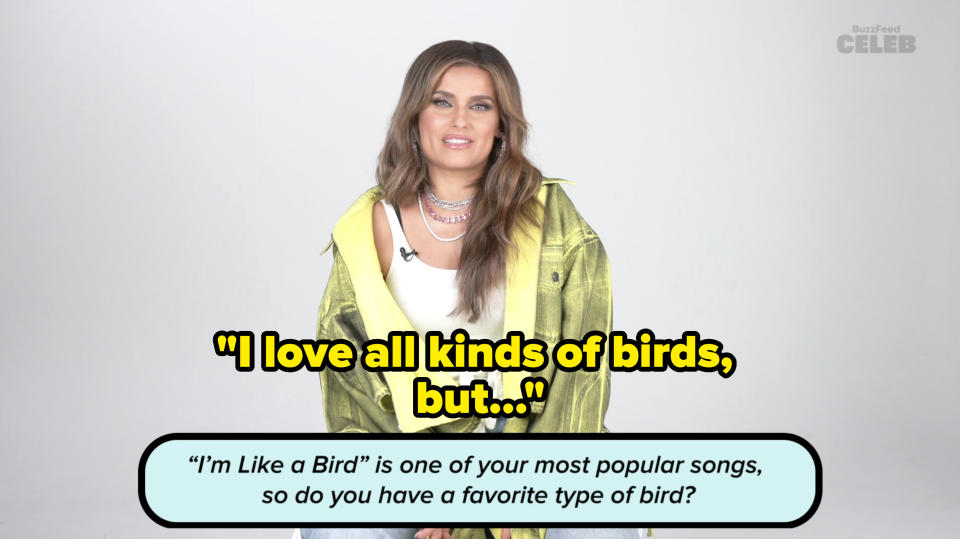 Nelly Furtado sits smiling in an interview. Text reads: "'I'm Like a Bird' is one of your most popular songs, so do you have a favorite type of bird?"