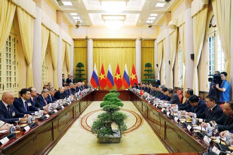 Putin and the Vietnamese president attended a meeting at the Presidential Palace (via REUTERS)