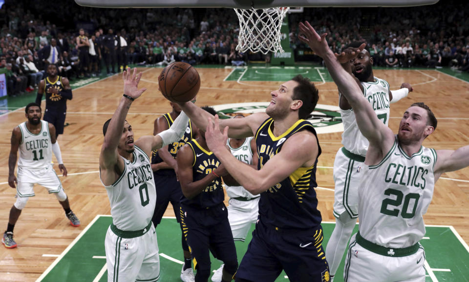 Indiana Pacers forward Bojan Bogdanovic drives to the basket past Boston Celtics forward Gordon Hayward (20) during the fourth quarter of Game 2 of an NBA basketball first-round playoff series, Wednesday, April 17, 2019, in Boston. The Celtics won 99-91. (AP Photo/Charles Krupa)